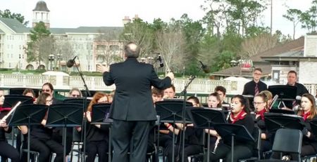 Another picture of the Sidney High School Concert Band performing on stage.