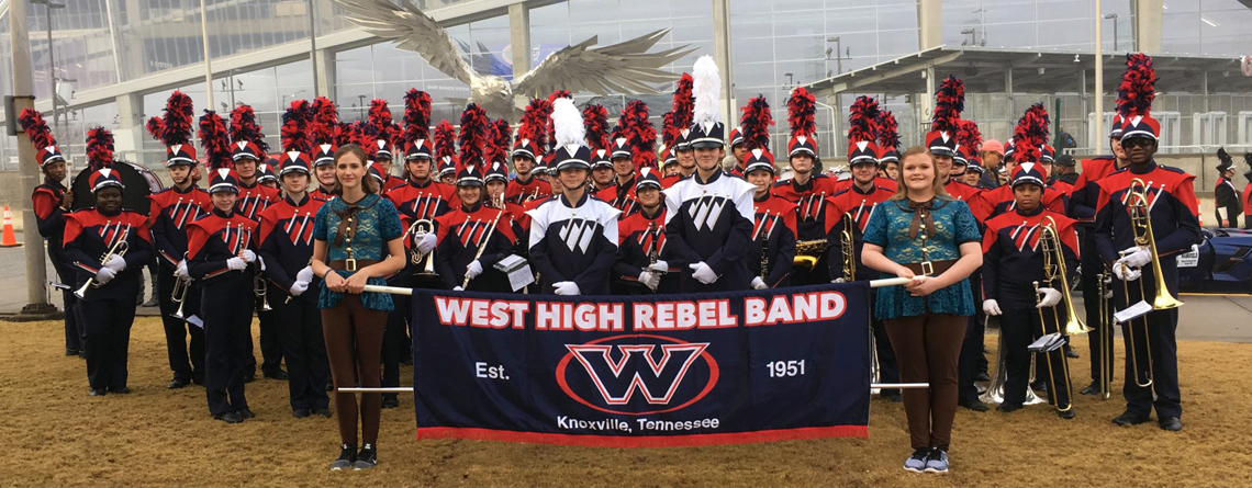 The West High School Rebels Marching Band in front of Mercedes-Benz Stadium.