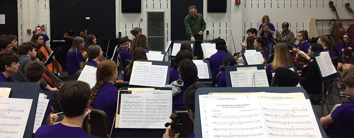 EHS orchestra working on expressing the musical idea with Dr. Samarov at Tulane University.