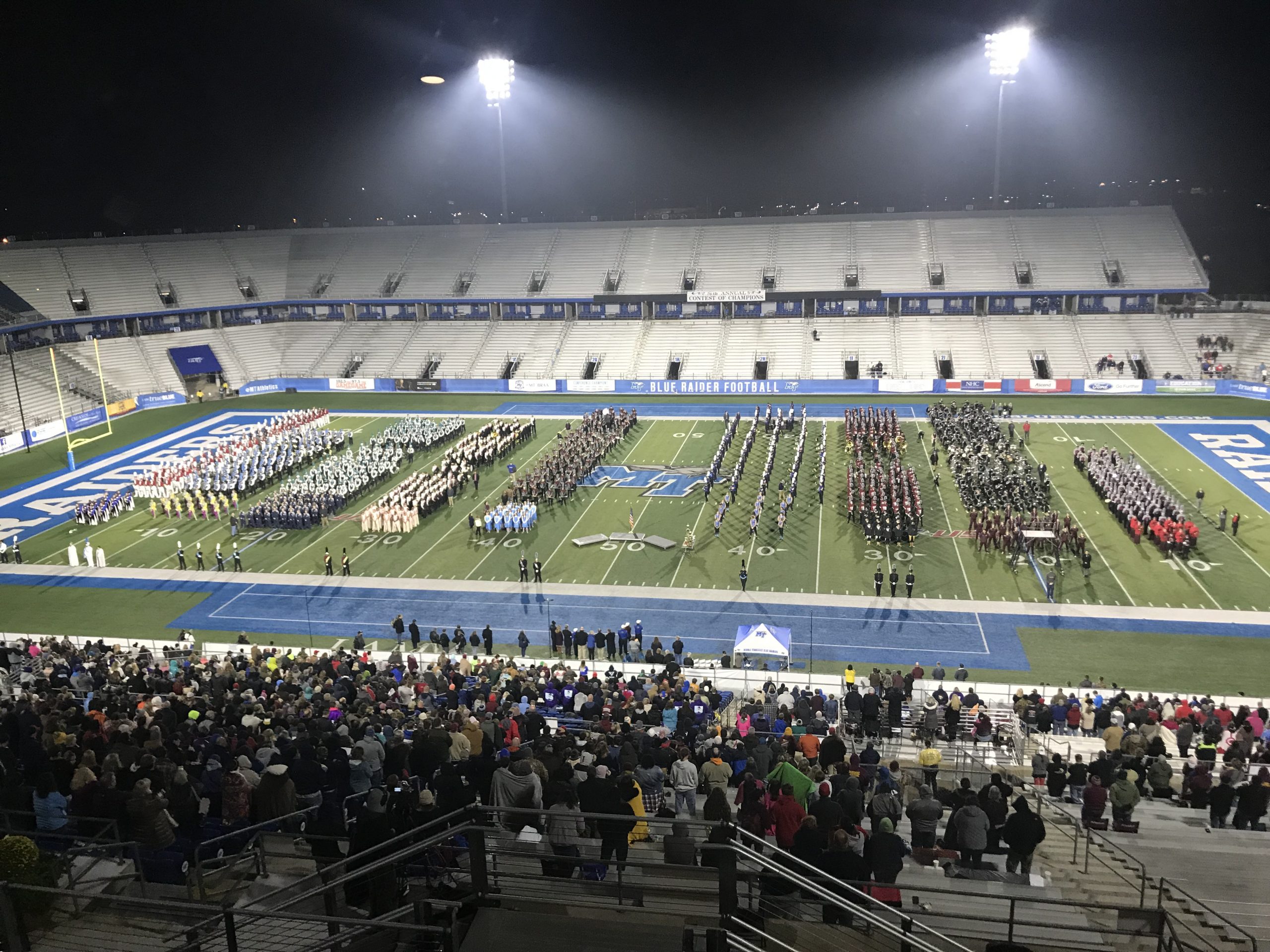 Finalists line up in ranks to fill the field for retreat at MTSU. Each band plays a snippet of their show prior to exiting the field.