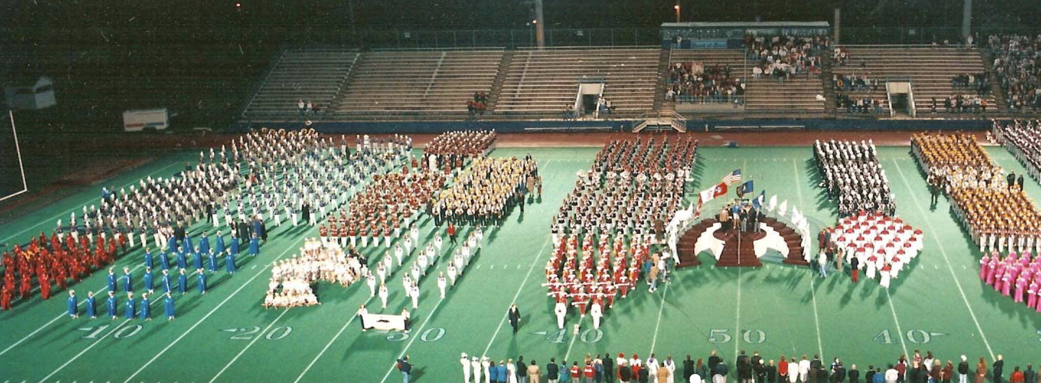 Bands line up for the awards ceremony at a Contest of Champions event years ago. It’s tradition that each group play a small portion of their show prior to leaving the field.