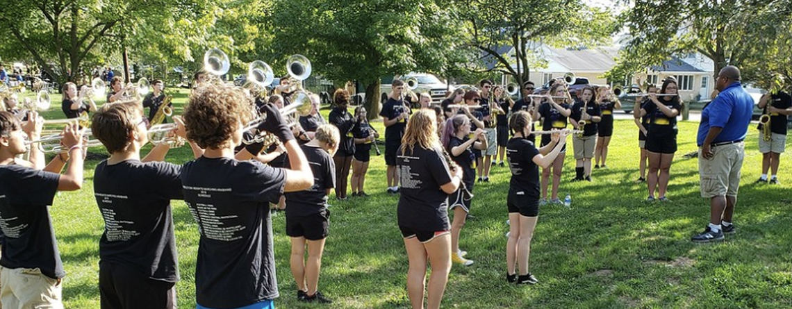 Director of Bands, Chris Taylor warms up the winds prior to a summer park performance. Taylor is the director at Pendleton Heights High School in Pendleton, Ind.