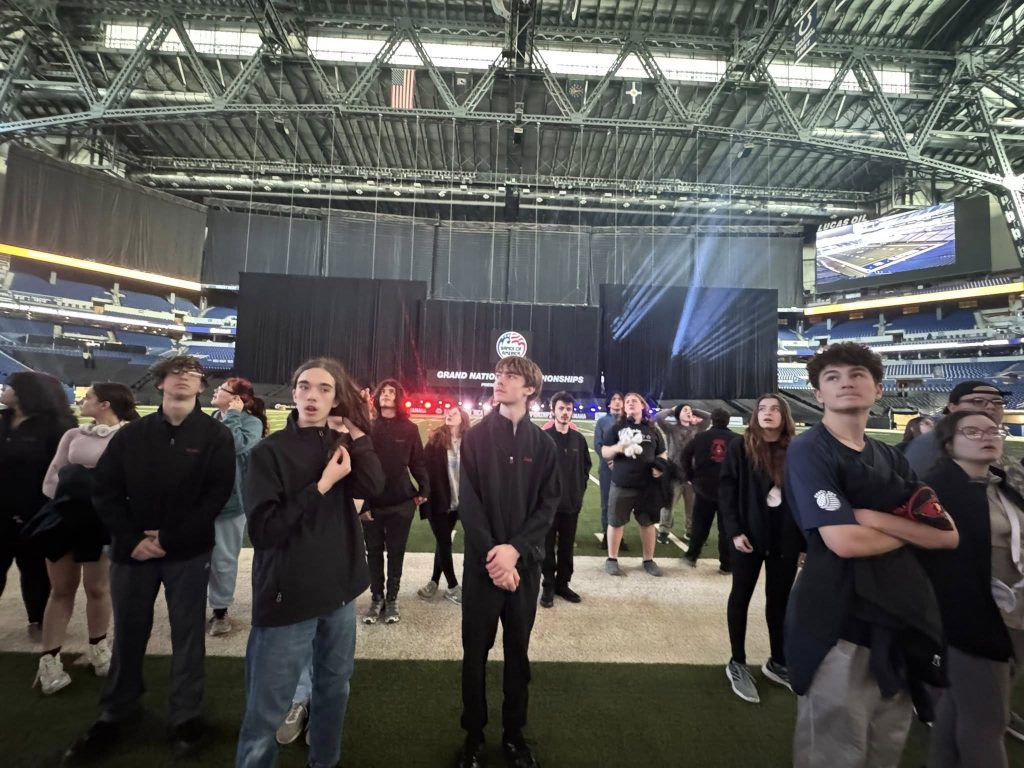 Students touring the field at Lucas Oil Stadium