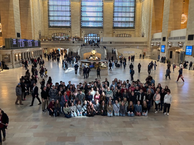 Evansville North HS of Indiana posing for a group photo in grand central station
