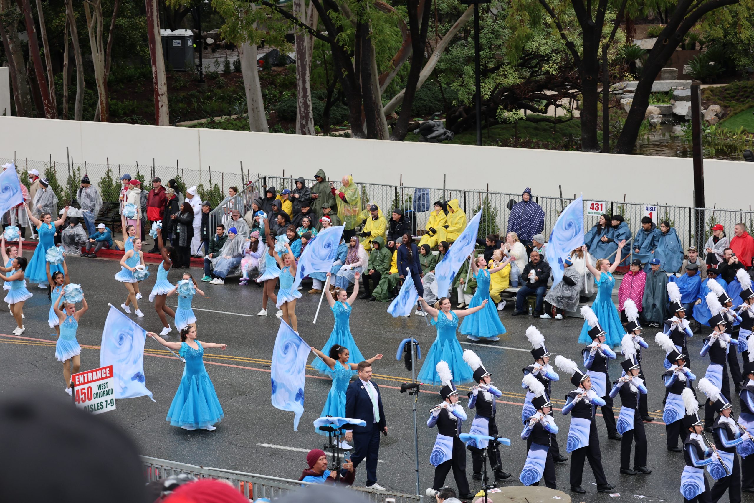 Band and colorguard members march in the Rose Parade