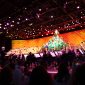 Wide shot image of entire stage performance of Disney's Candlelight processional featuring a mass choir and orchestra
