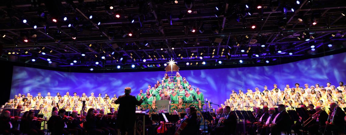 Orchestra and choir on stage for Disney's Candlelight Processional