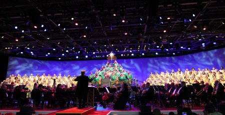 Orchestra and choir on stage for Disney's Candlelight Processional