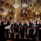 choir students singing with an ornate background