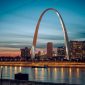 The Gateway Arch glowing at night in St. Louis, a high-value stop for student band trips